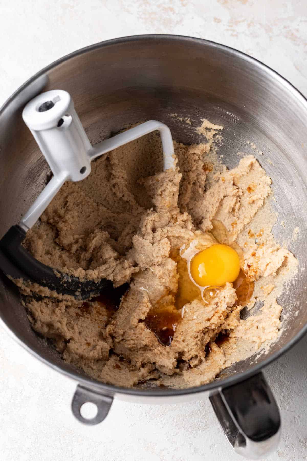 Egg and vanilla on top of creamed butter and sugar mixture.