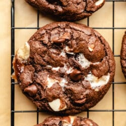 A rocky road cookie on a black cooling rack.