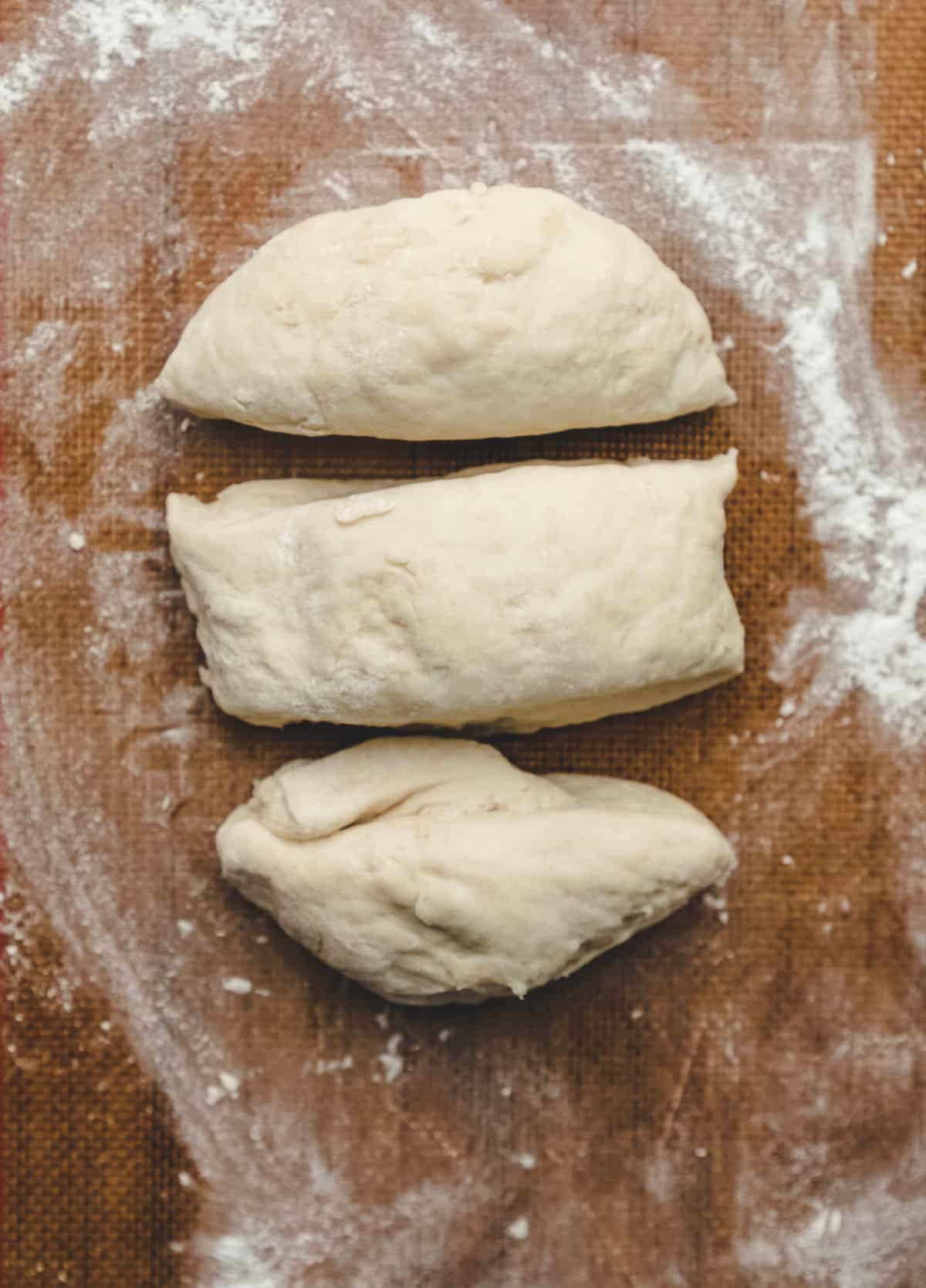 Sopaipilla dough cut into 3 pieces. 