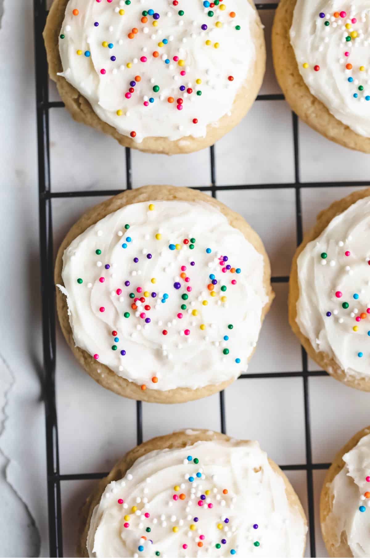 Sour Cream Sugar Cookie Recipe Three sour cream sugar cookies in a row.