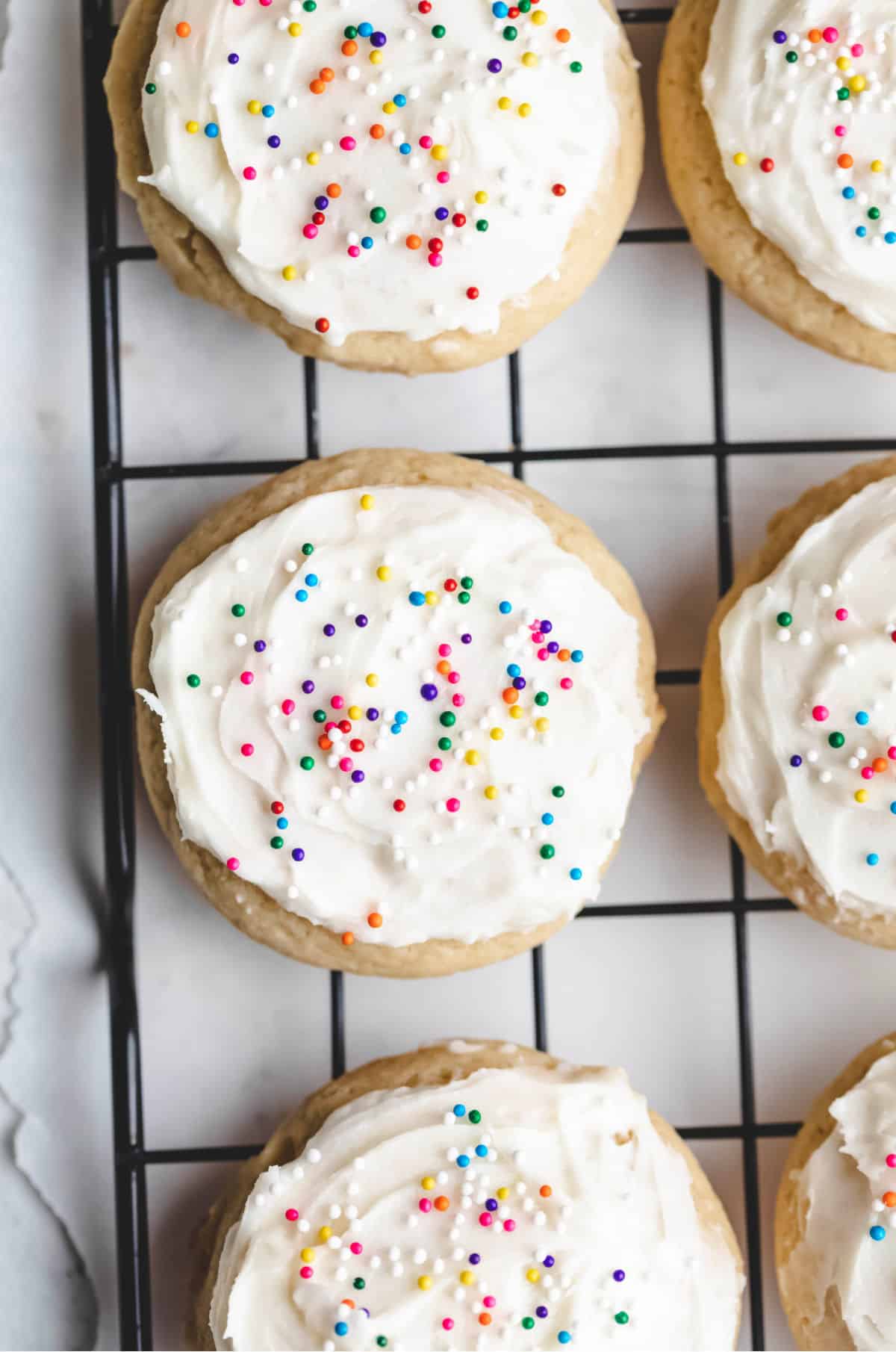 Three sour cream sugar cookies in a row. 