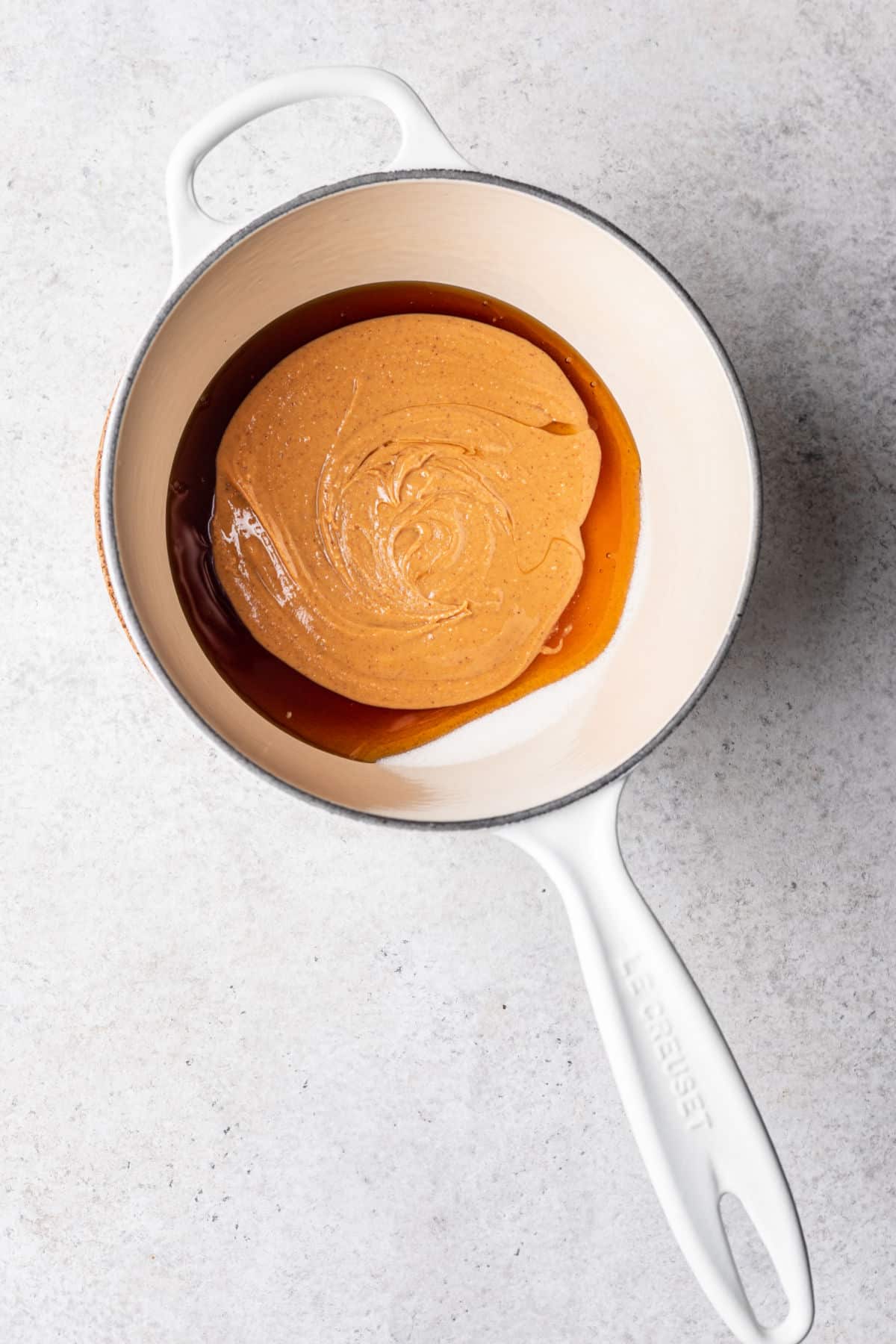 Peanut butter and honey in a saucepan.