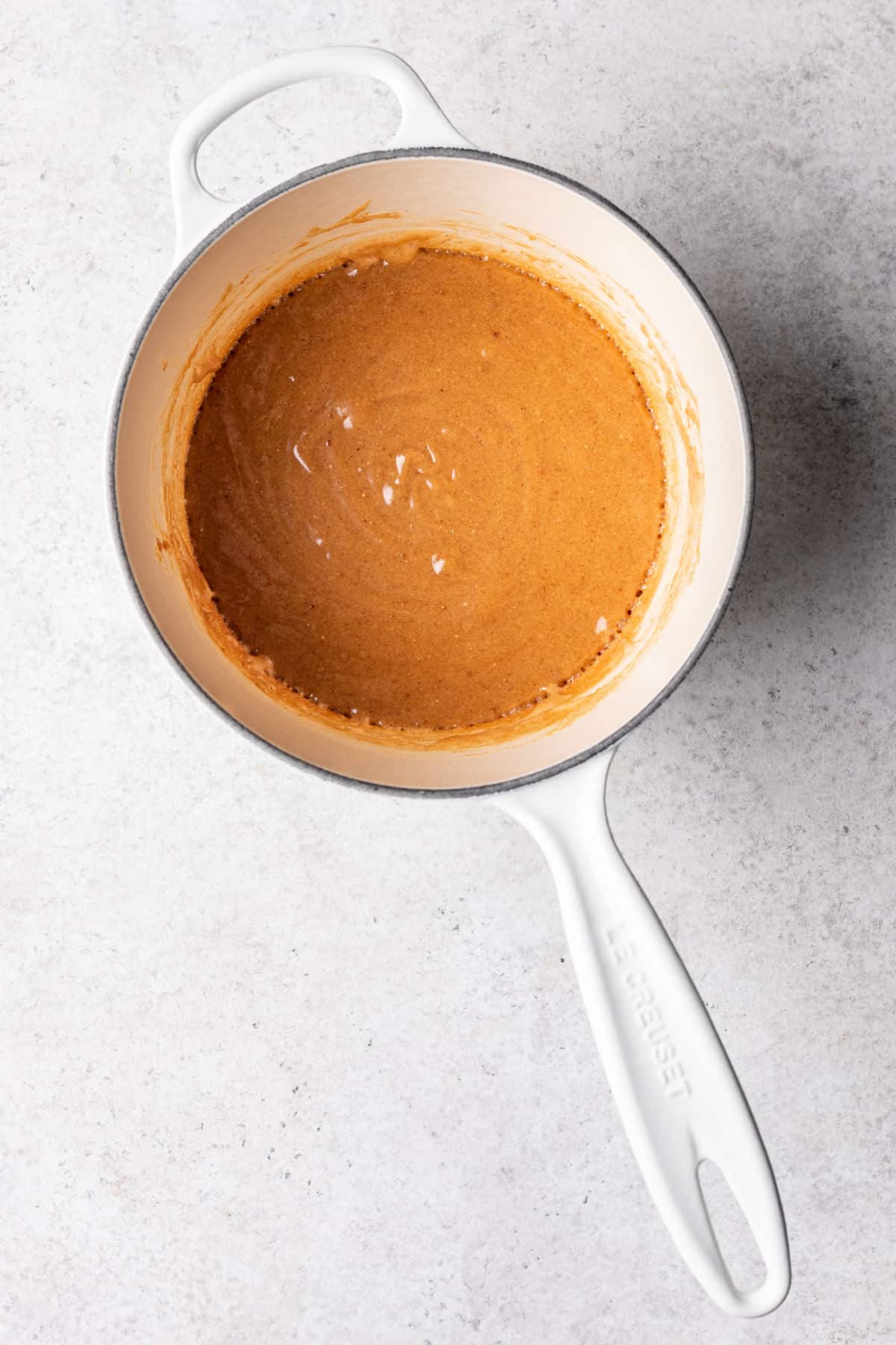 Cooked peanut butter mixture in a saucepan.