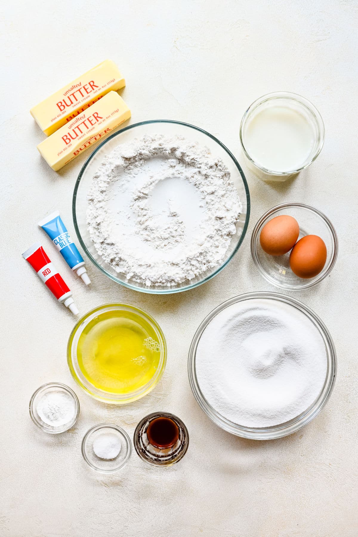 Ingredients for red white and blue bundt cake in dishes. 