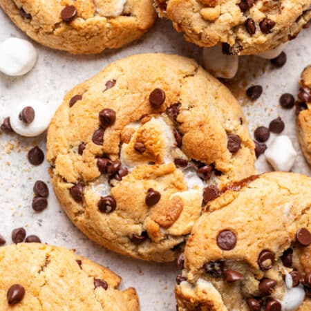 S'mores cookies next to marshmallows and chocolate chips.