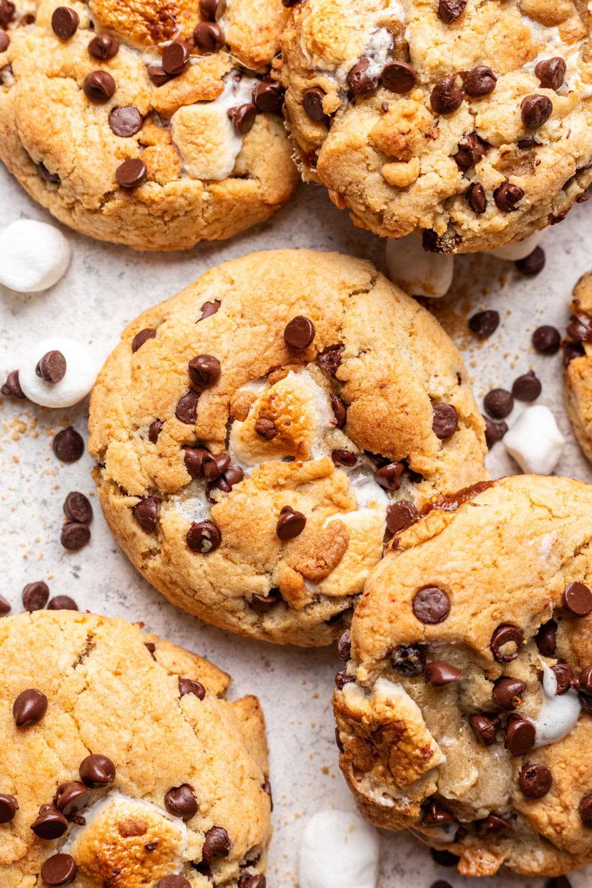 S'mores cookies next to marshmallows and chocolate chips.