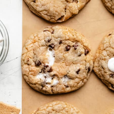 S'mores cookies next to graham crackers and marshmallows.