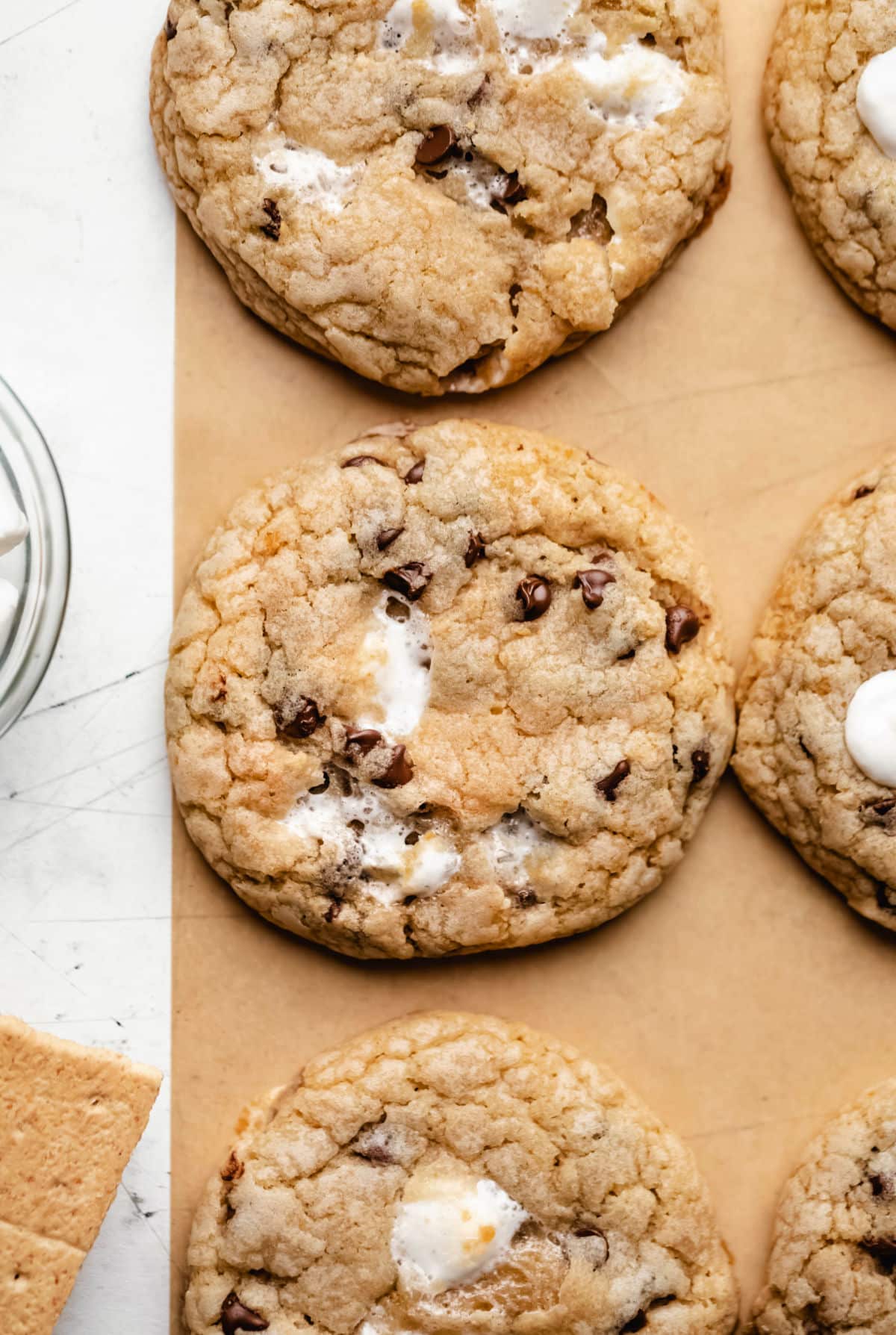 S'mores cookies next to graham crackers and a dish of marshmallows. 