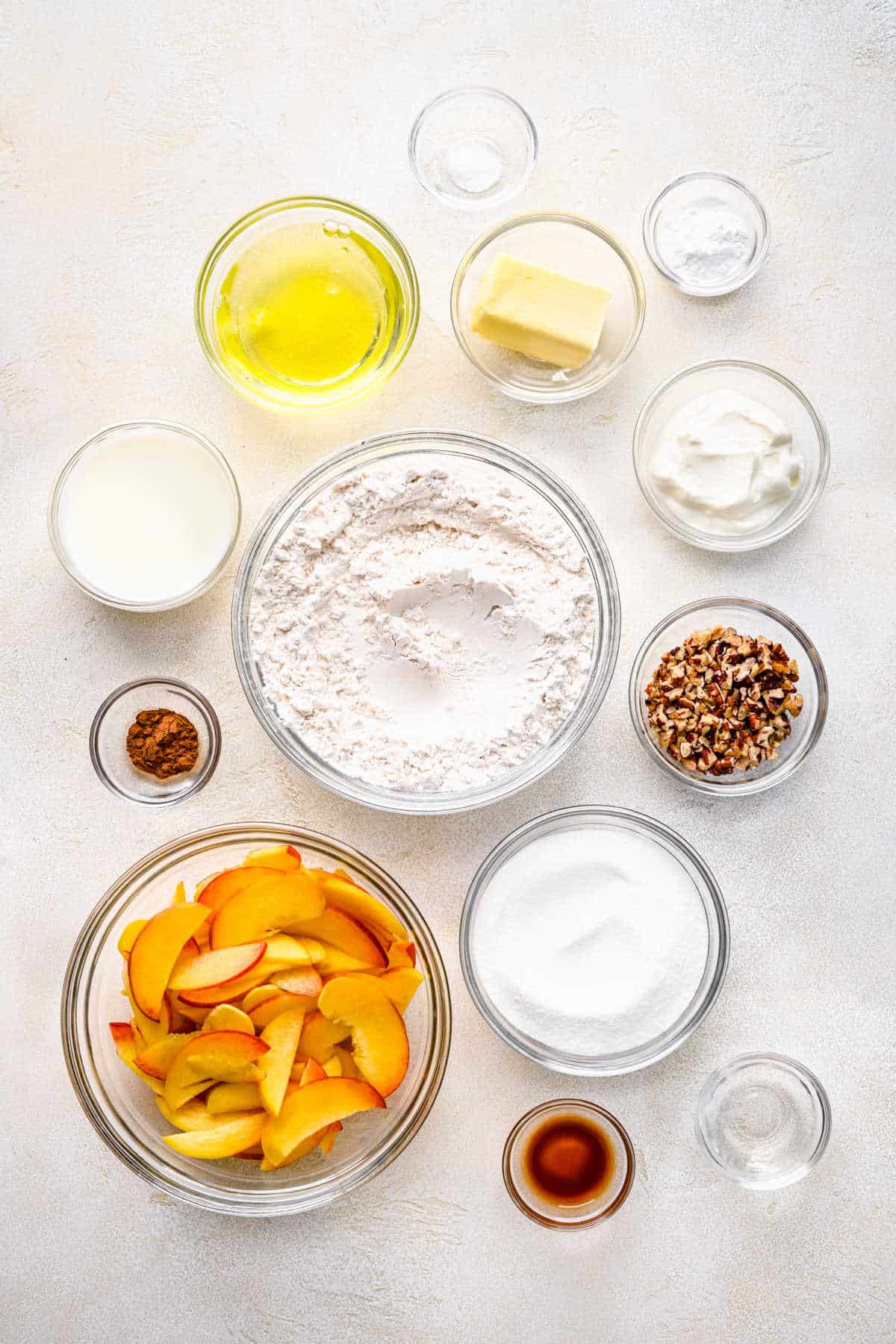 Ingredients for peach cake in dishes.