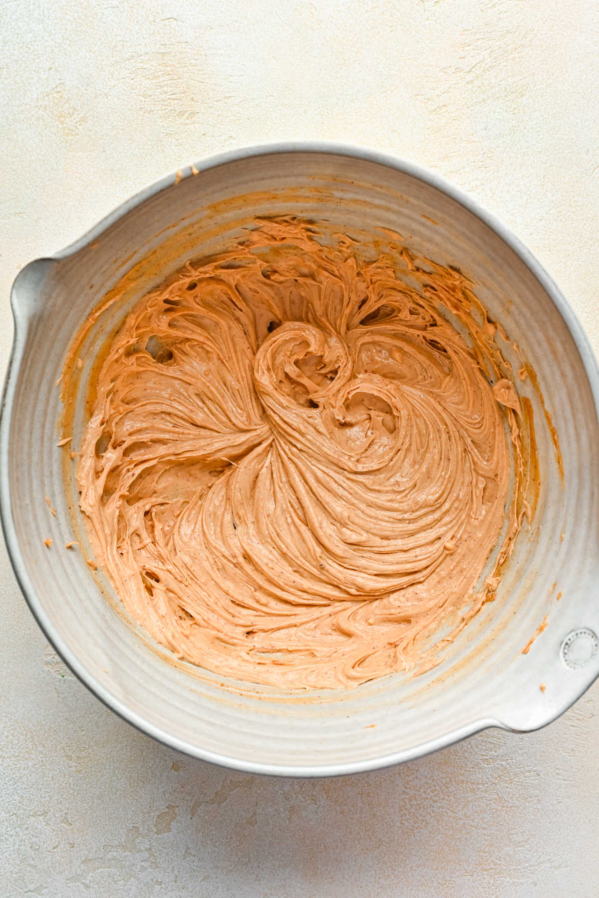 Creamed butter and peanut butter in a mixing bowl. 