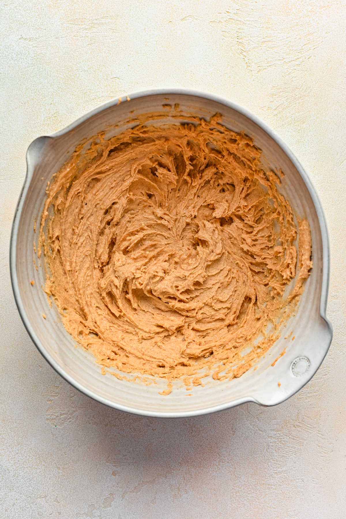 Creamed butter peanut butter and sugar in a mixing bowl. 