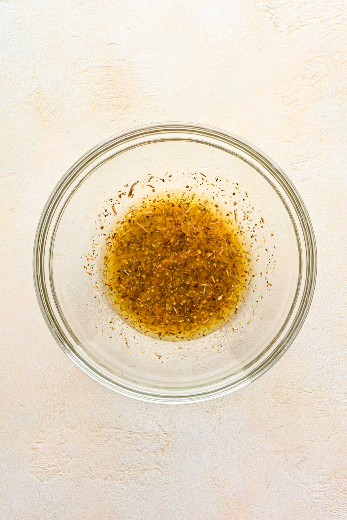 Garlic butter in a glass mixing bowl. 