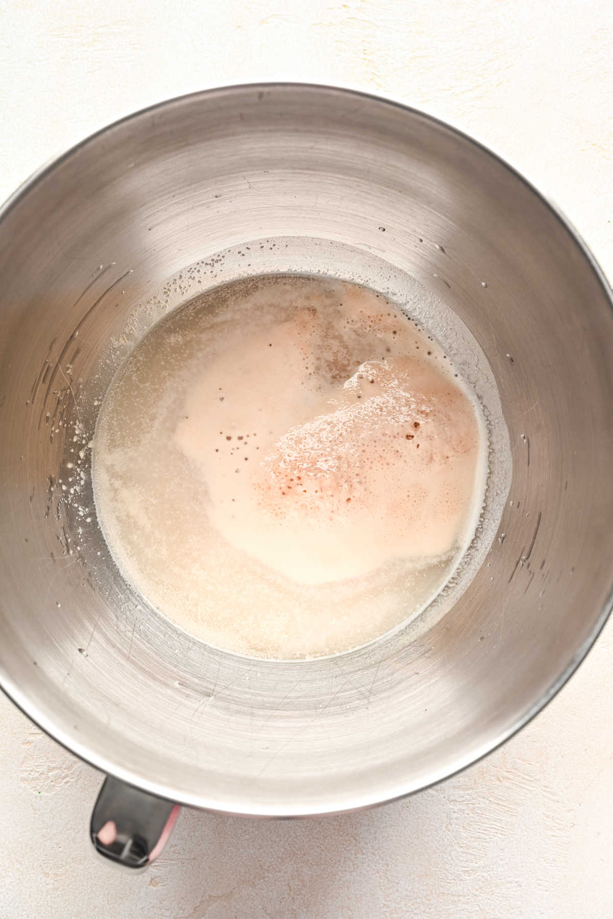 Foamy yeast in water.