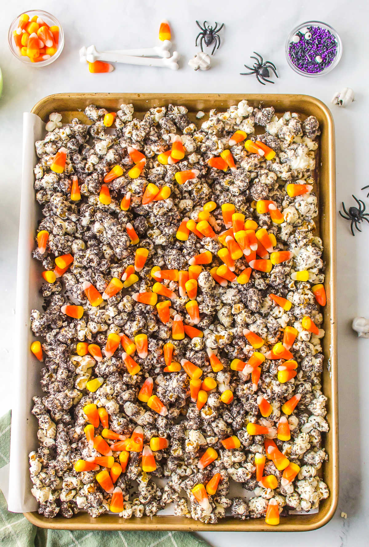 Candy corn sprinkled over Oreo cookie crumb popcorn mixture. 