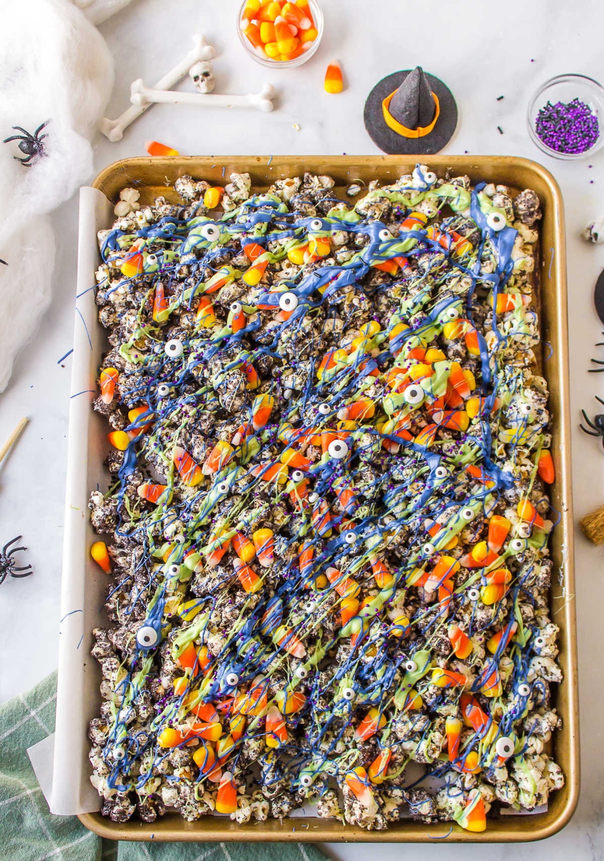 Halloween popcorn in a rimmed baking sheet. 