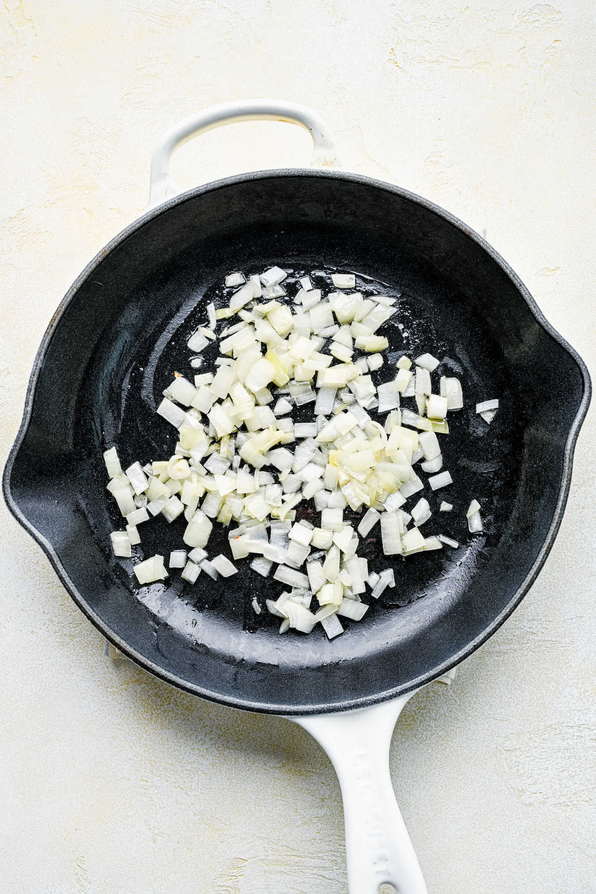 Diced onion in butter in a cast iron skillet. 