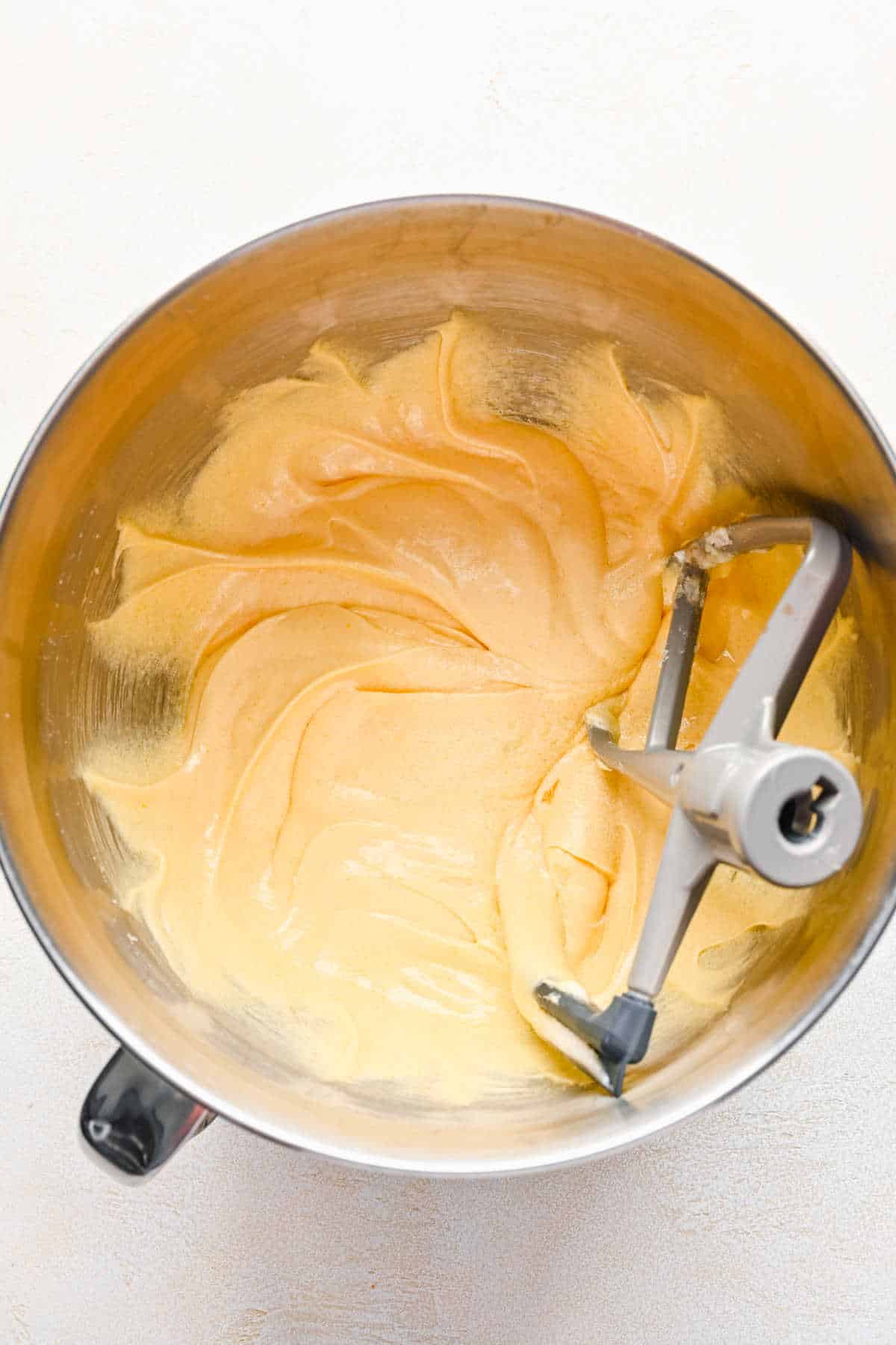 Eggs and egg yolks beaten into creamed butter and oil mixture.