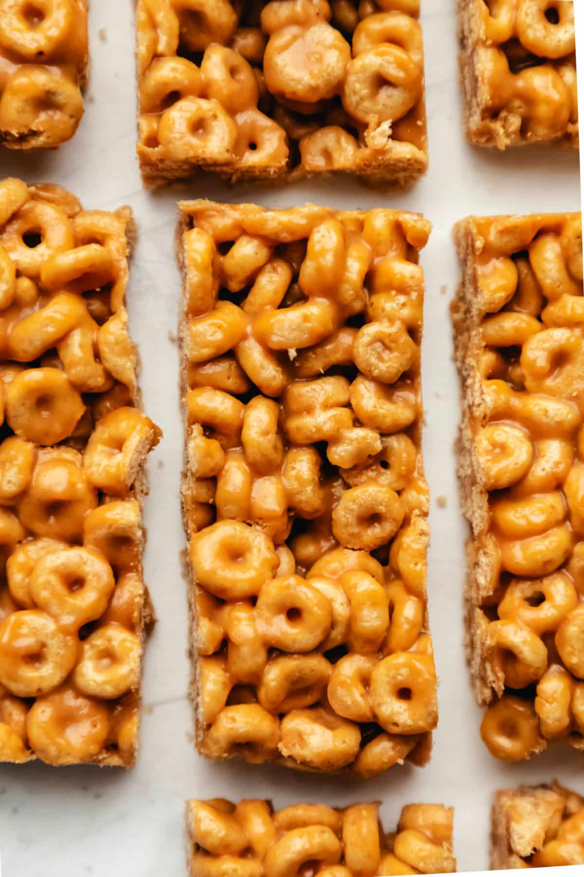 Rectangular cheerio bars on a piece of white parchment paper.