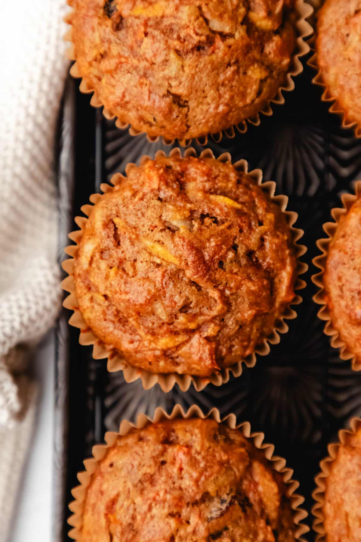 Close up photo of morning glory muffins on a vintage baking sheet. 