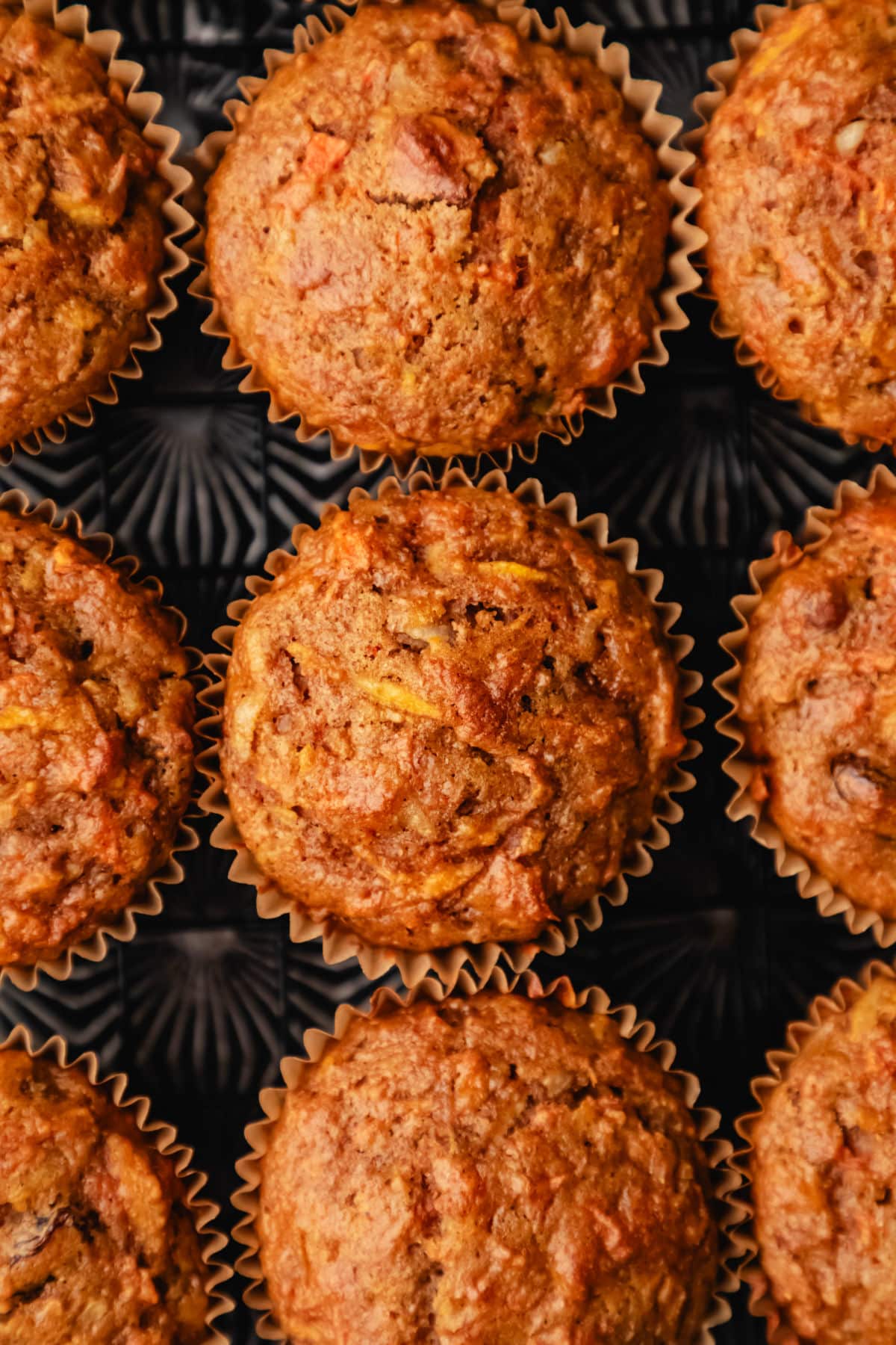 Morning Glory Muffin Recipe Morning glory muffins in rows on a vintage baking sheet.