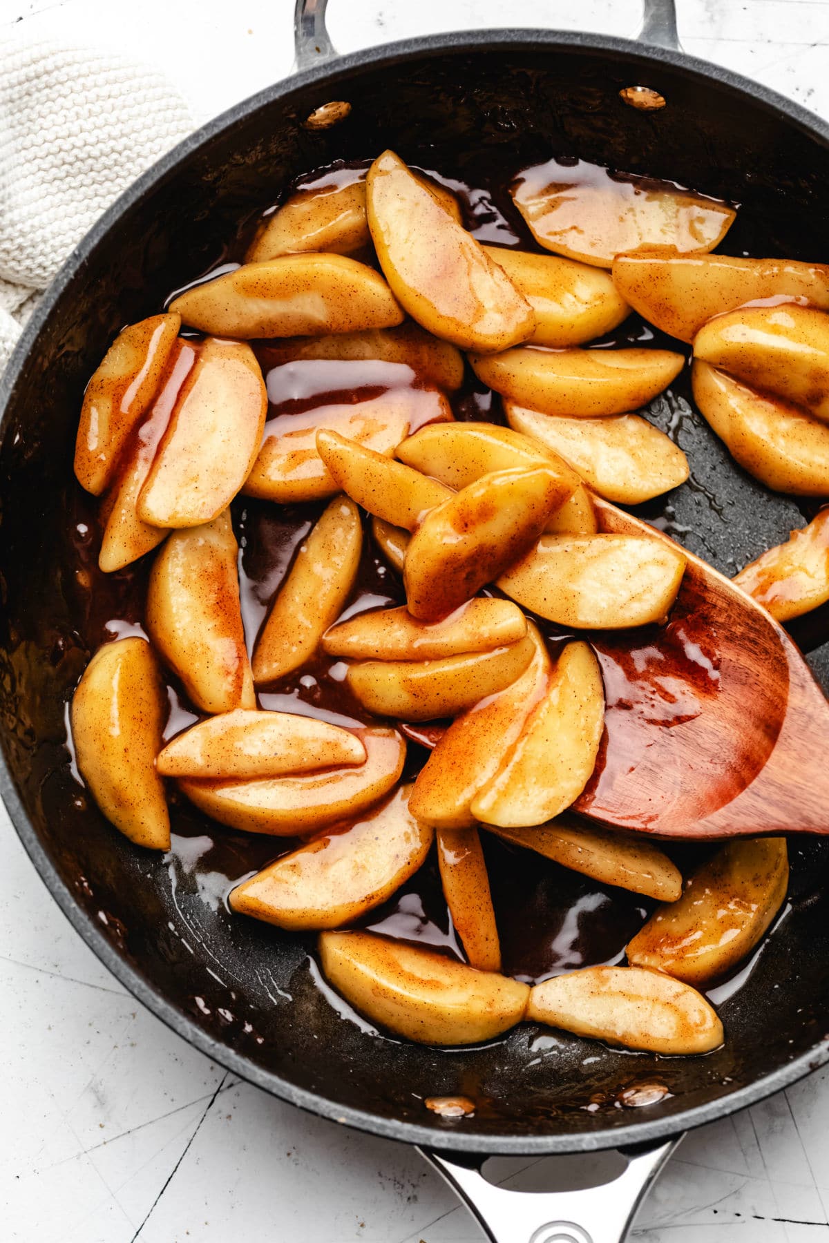 Sauteed cinnamon apples in a cast iron skillet.