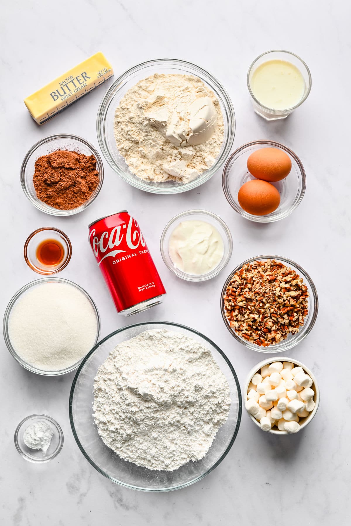 Ingredients for Coca Cola cake in dishes. 