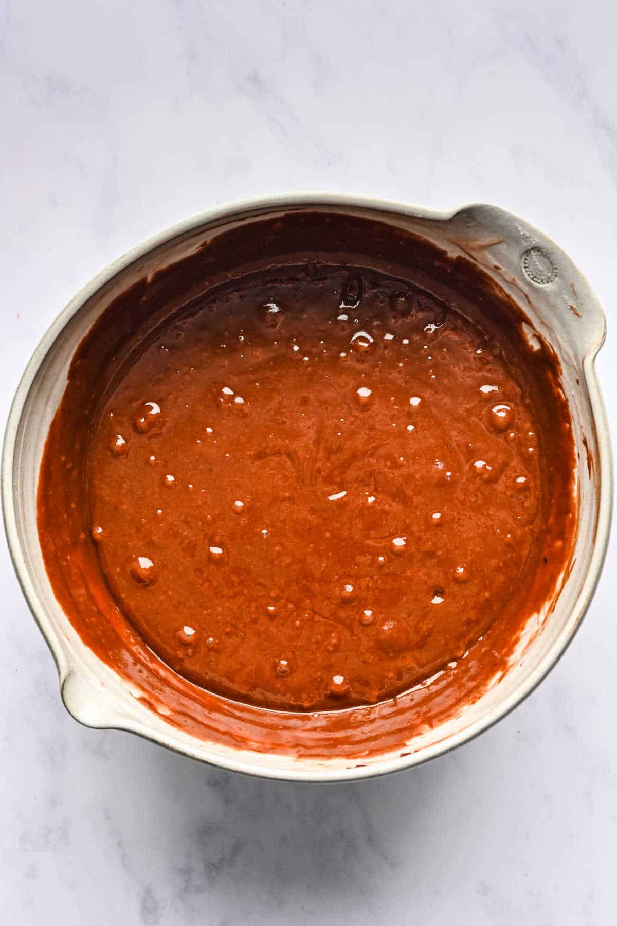 Coca Cola cake batter in a mixing bowl. 