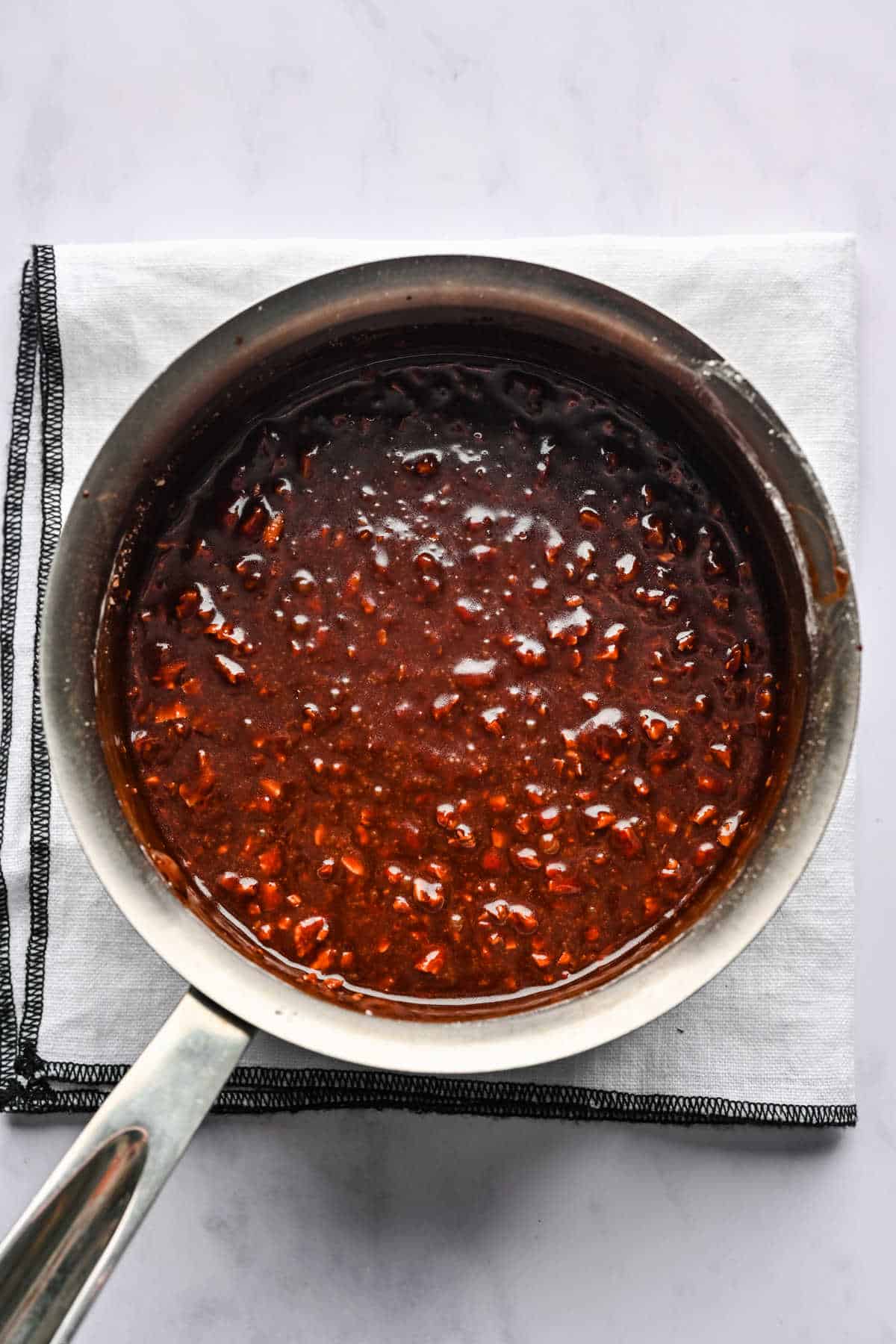 Coca Cola cake icing in a saucepan.