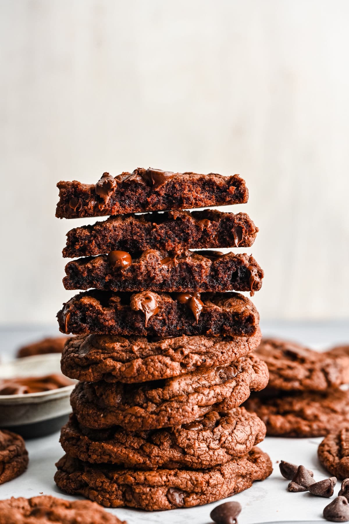 Two nutella cookies broken in half and stack on each other.