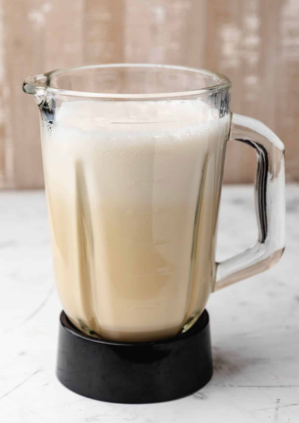 Ingredients for baked custard blended in a blender.