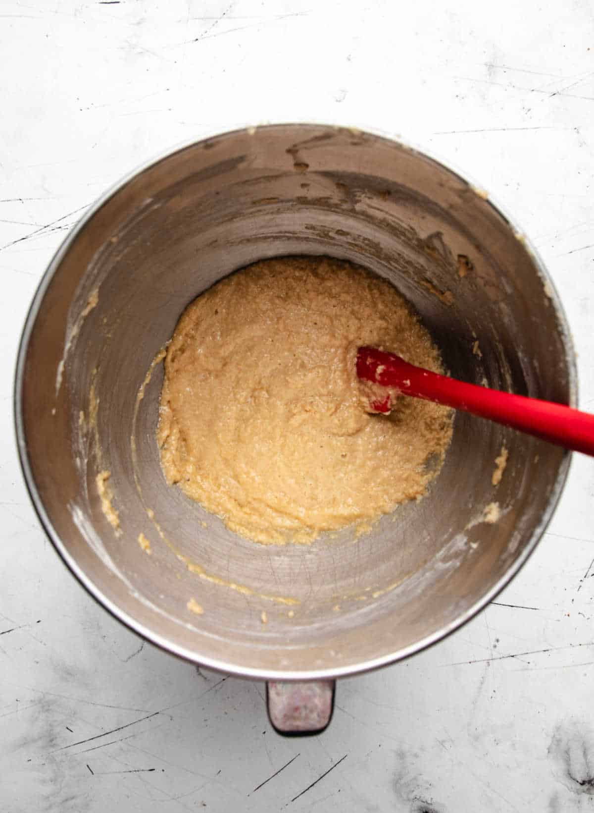 Eggs beaten into creamed butter and sugar mixture.