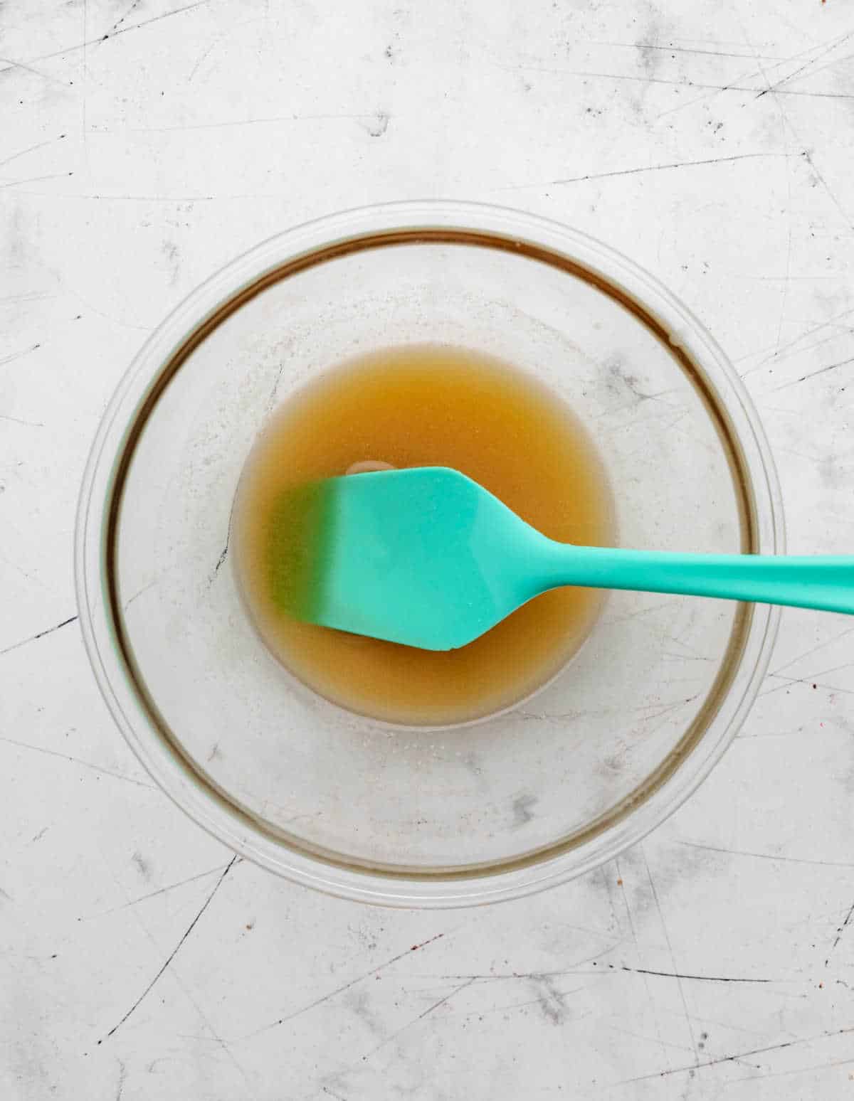 Honey butter mixture in a glass mixing bowl. 