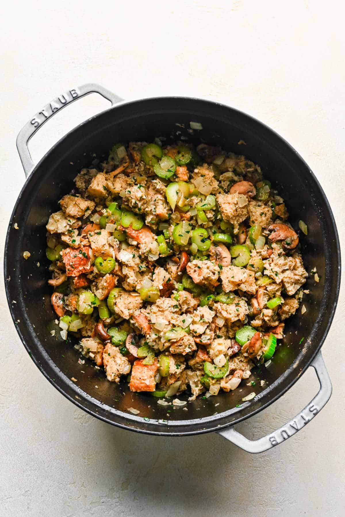 Bread cubes in vegetable mixture for homemade stuffing.