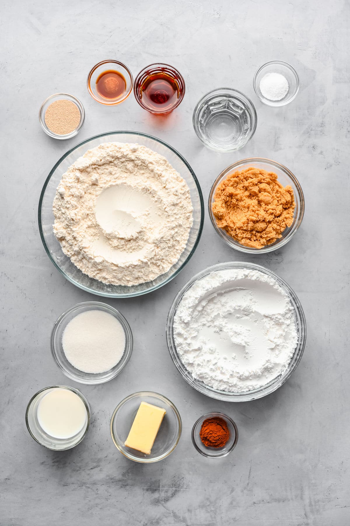 Ingredients for maple cinnamon rolls in dishes. 