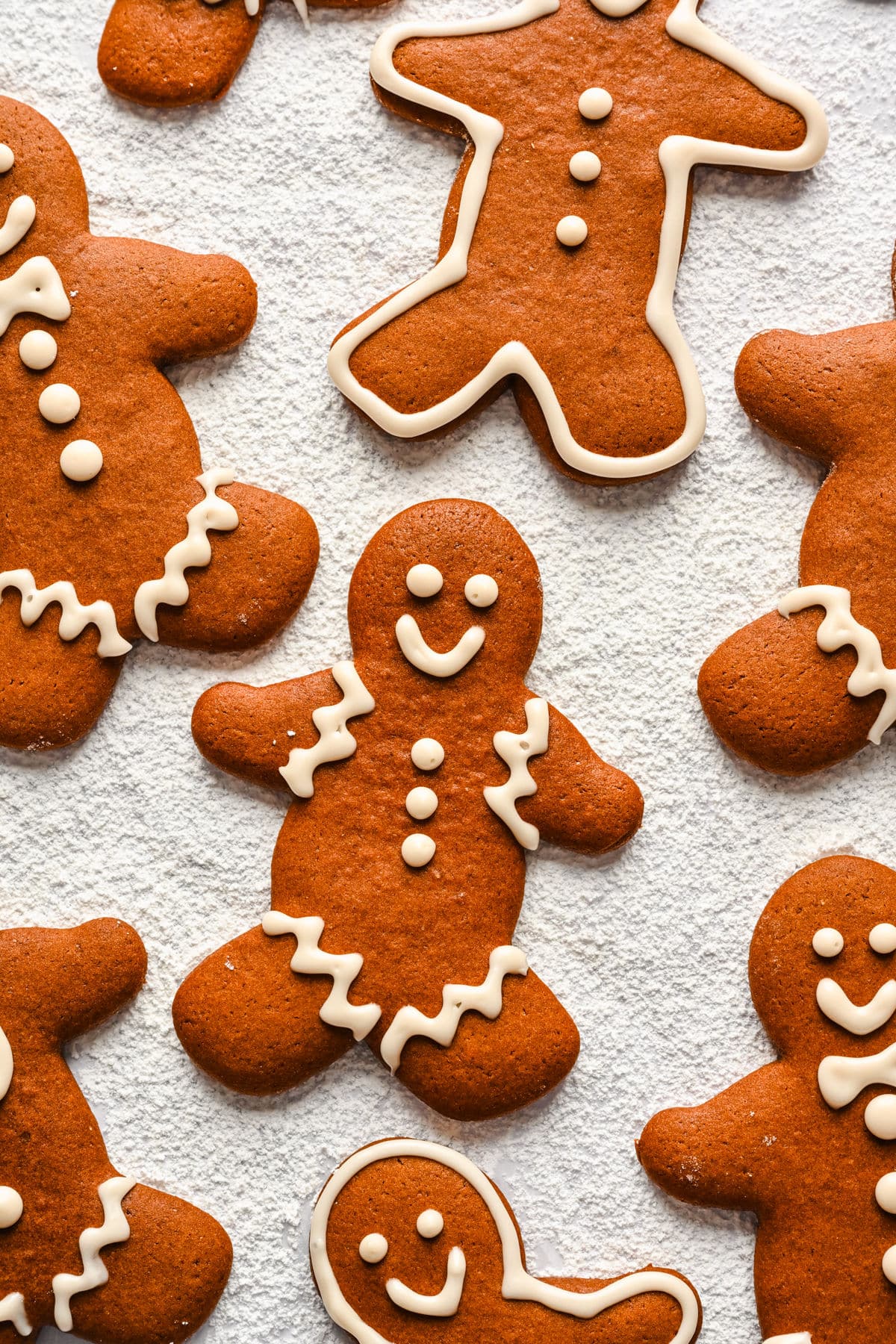 No chill gingerbread men on a powdered sugar surface.