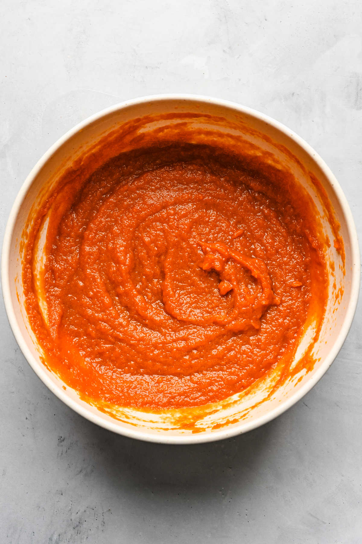 Pumpkin mixture in a large mixing bowl. 