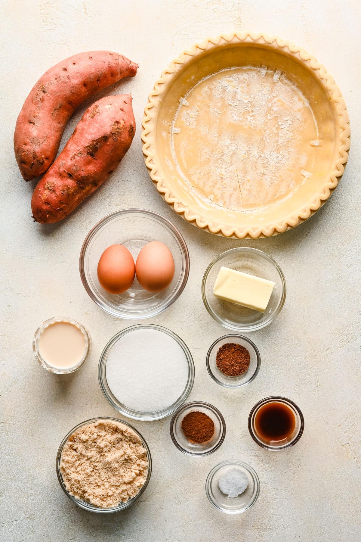 Ingredients for sweet potato pie in dishes.