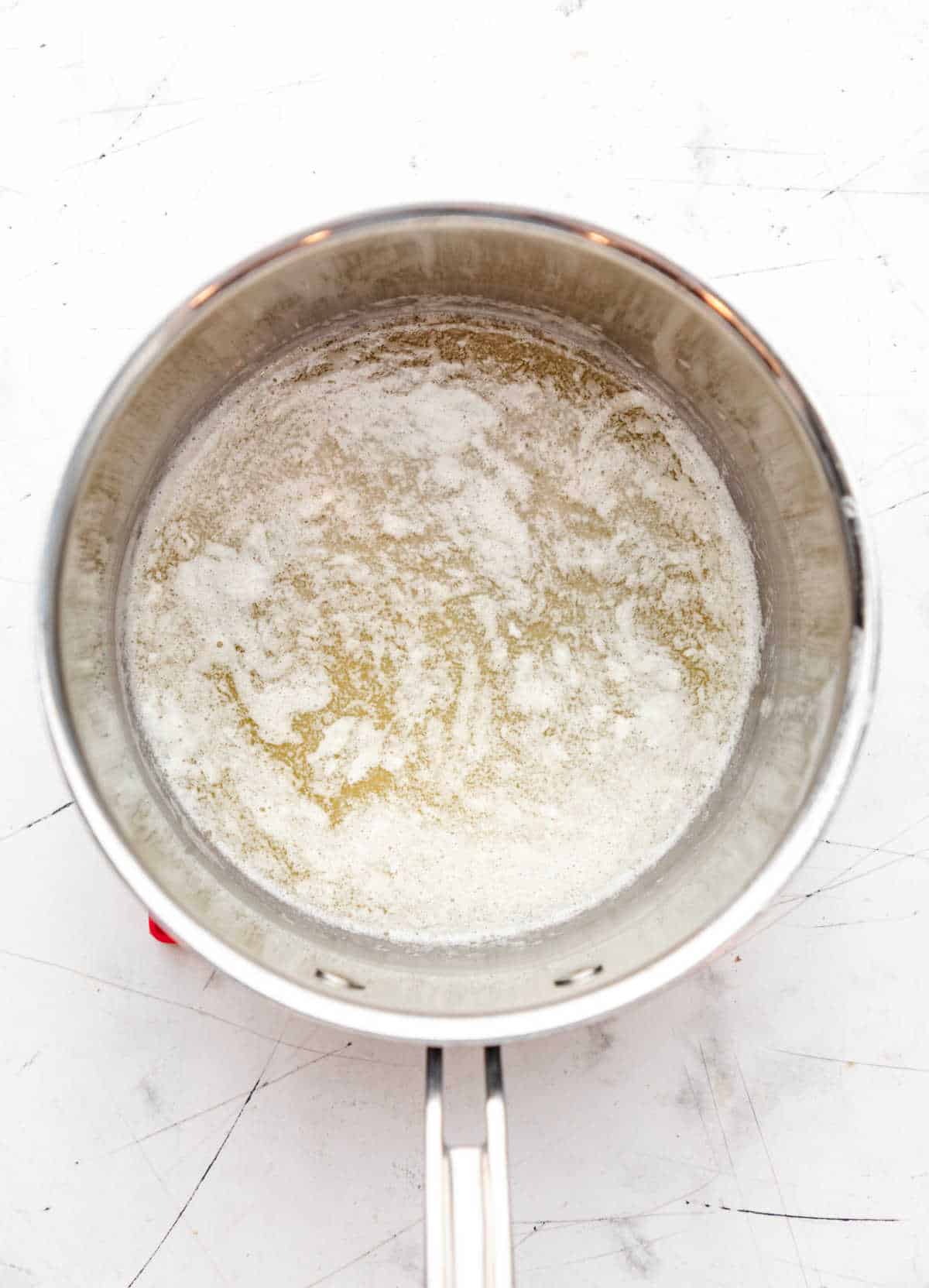 Melted butter in a saucepan.