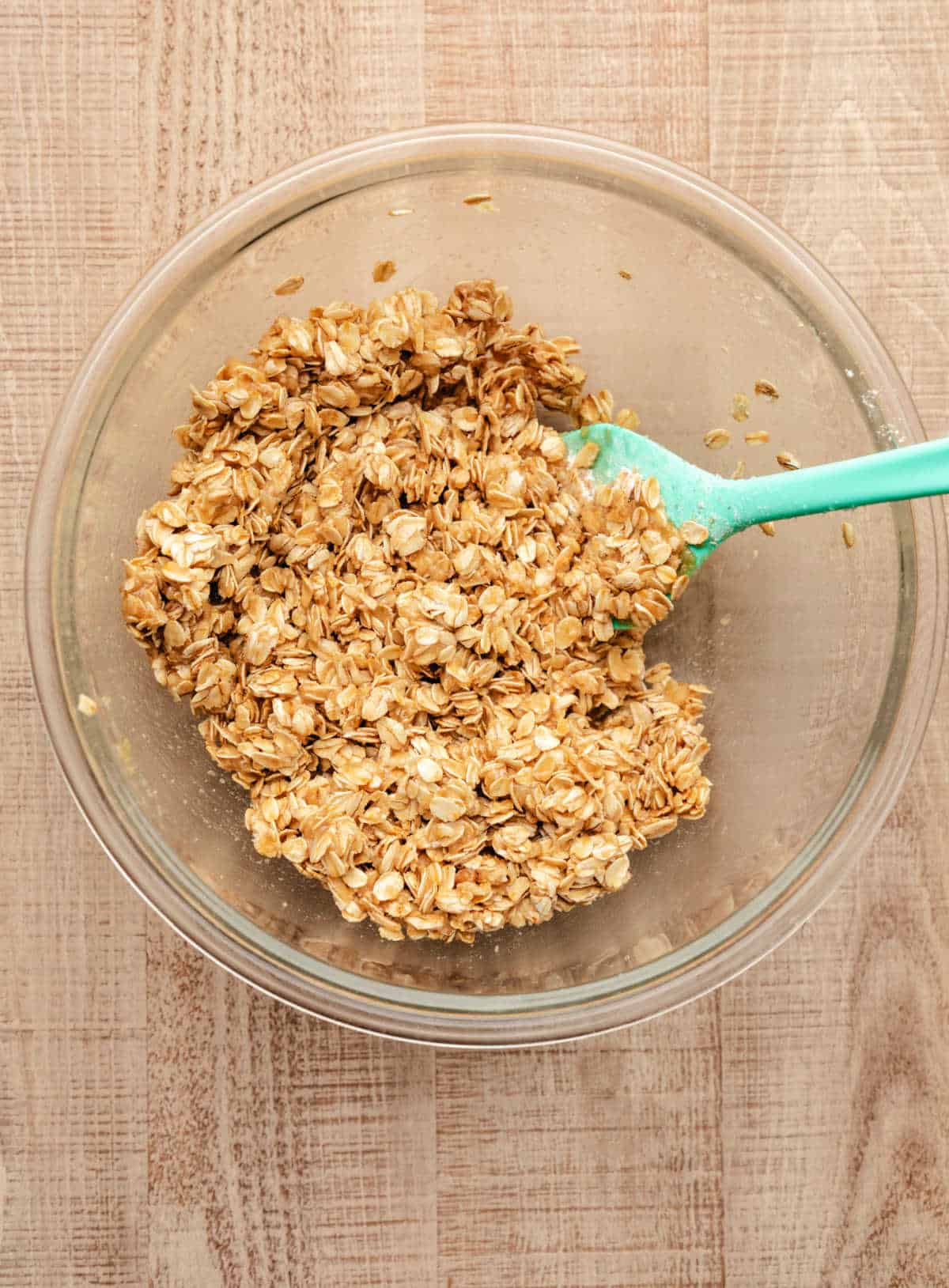 Cranberry apple crisp topping in a glass mixing bowl. 