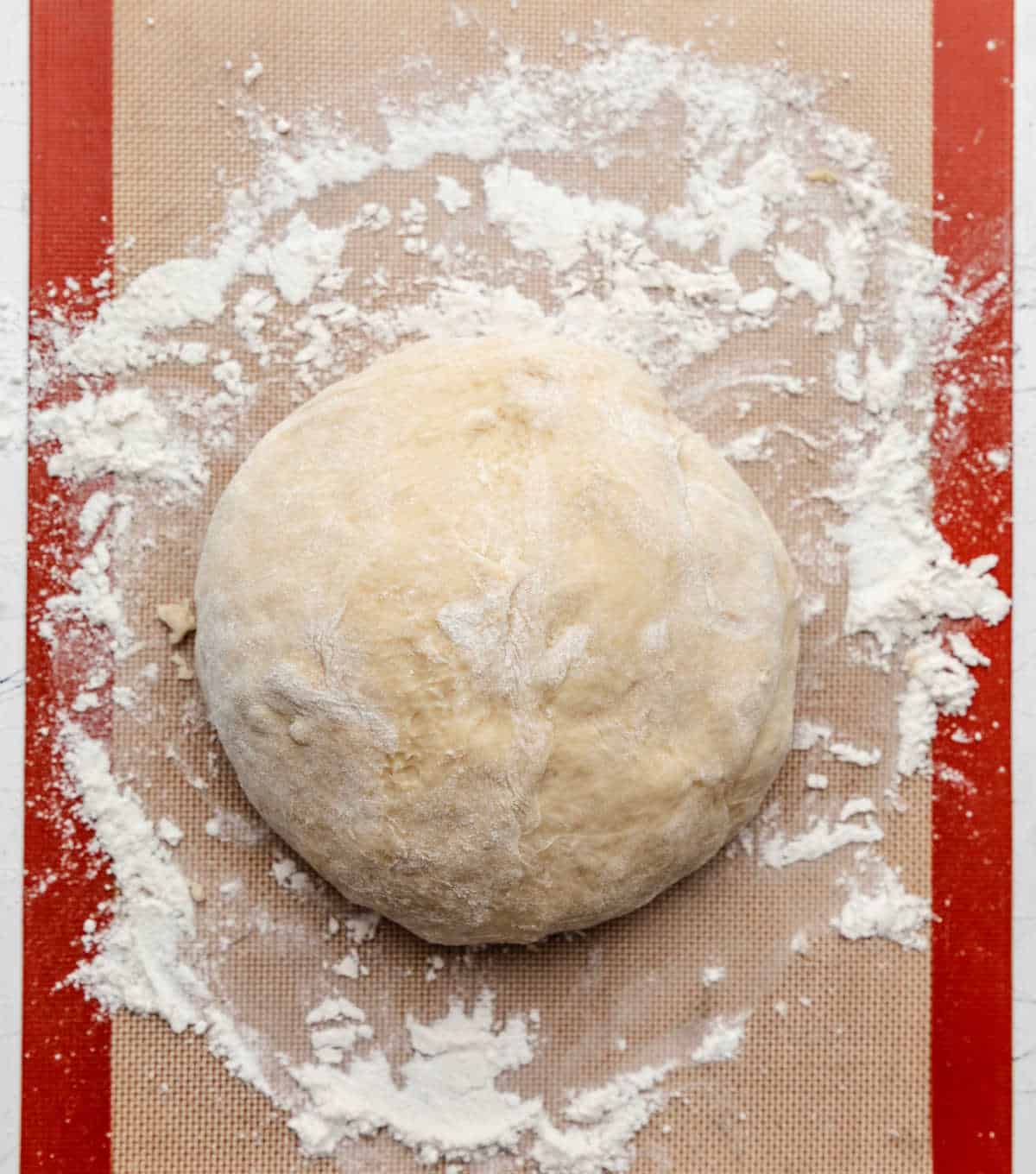 Potato roll dough on a heavily floured surface. 