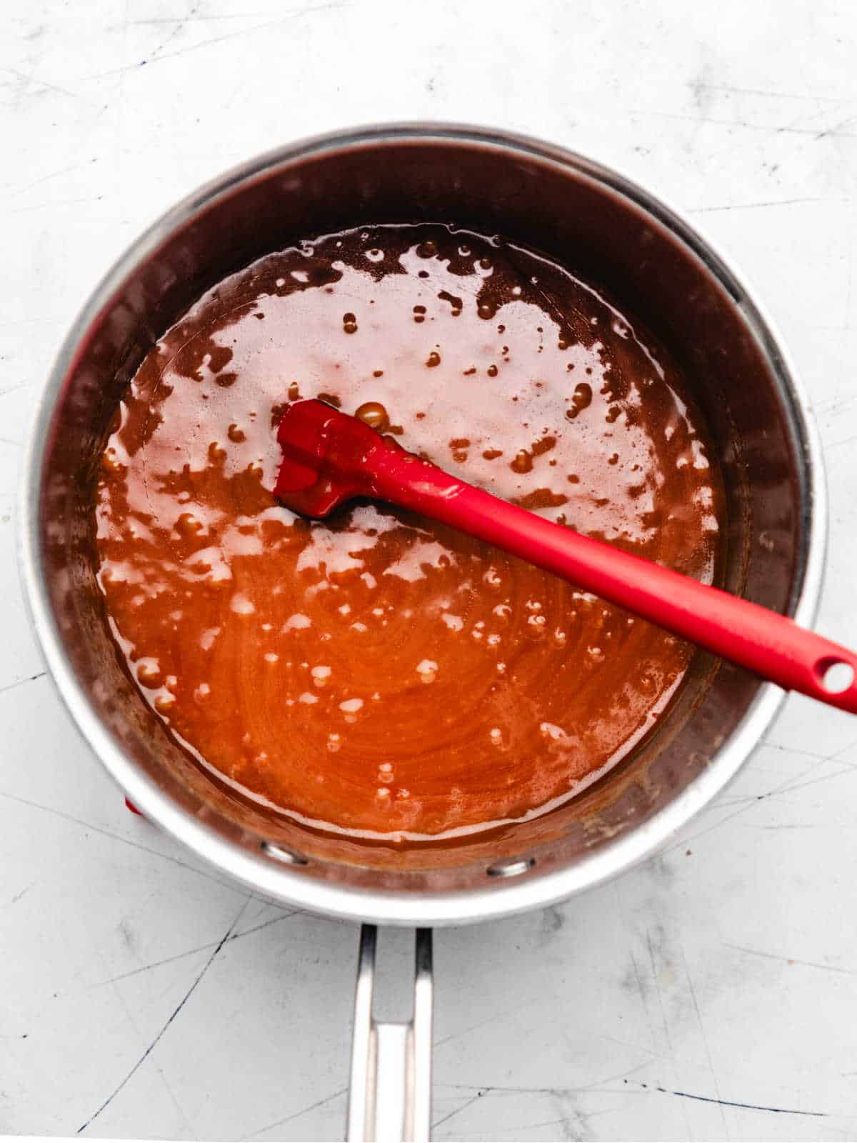 Cooked toffee mixture in a saucepan.