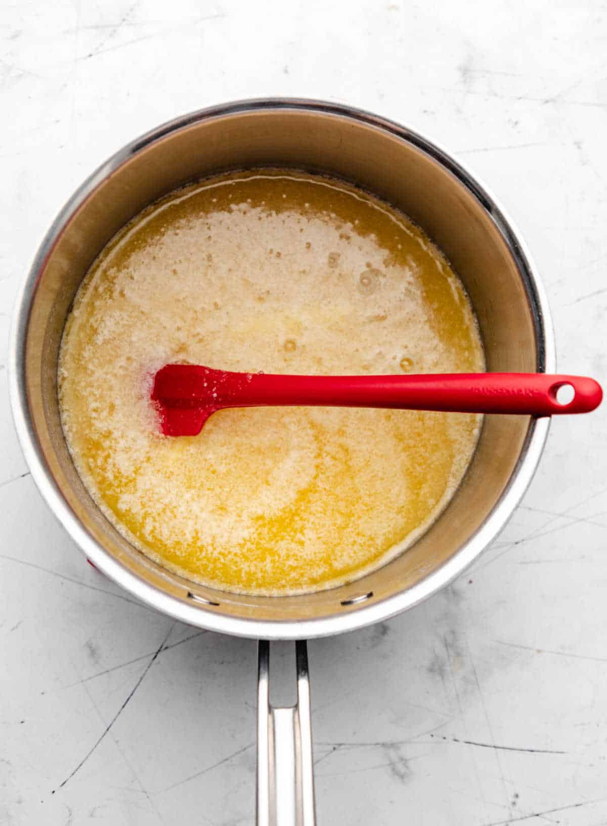 Melted butter and sugar in a saucepan.