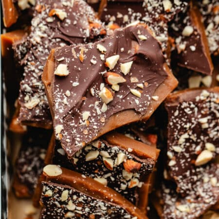 Homemade toffee topped with chocolate and chopped almonds.