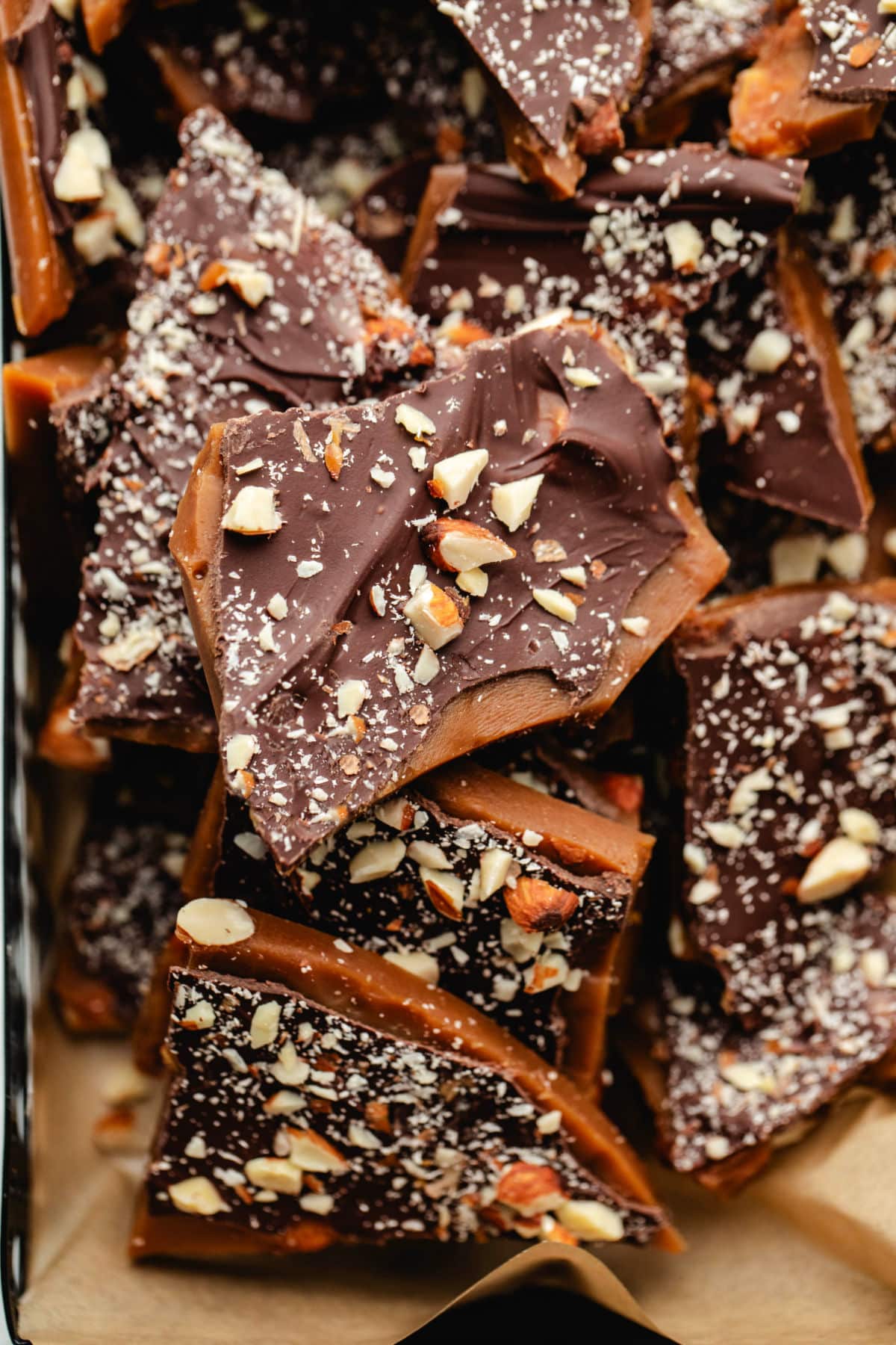 Homemade toffee topped with chocolate and chopped almonds.