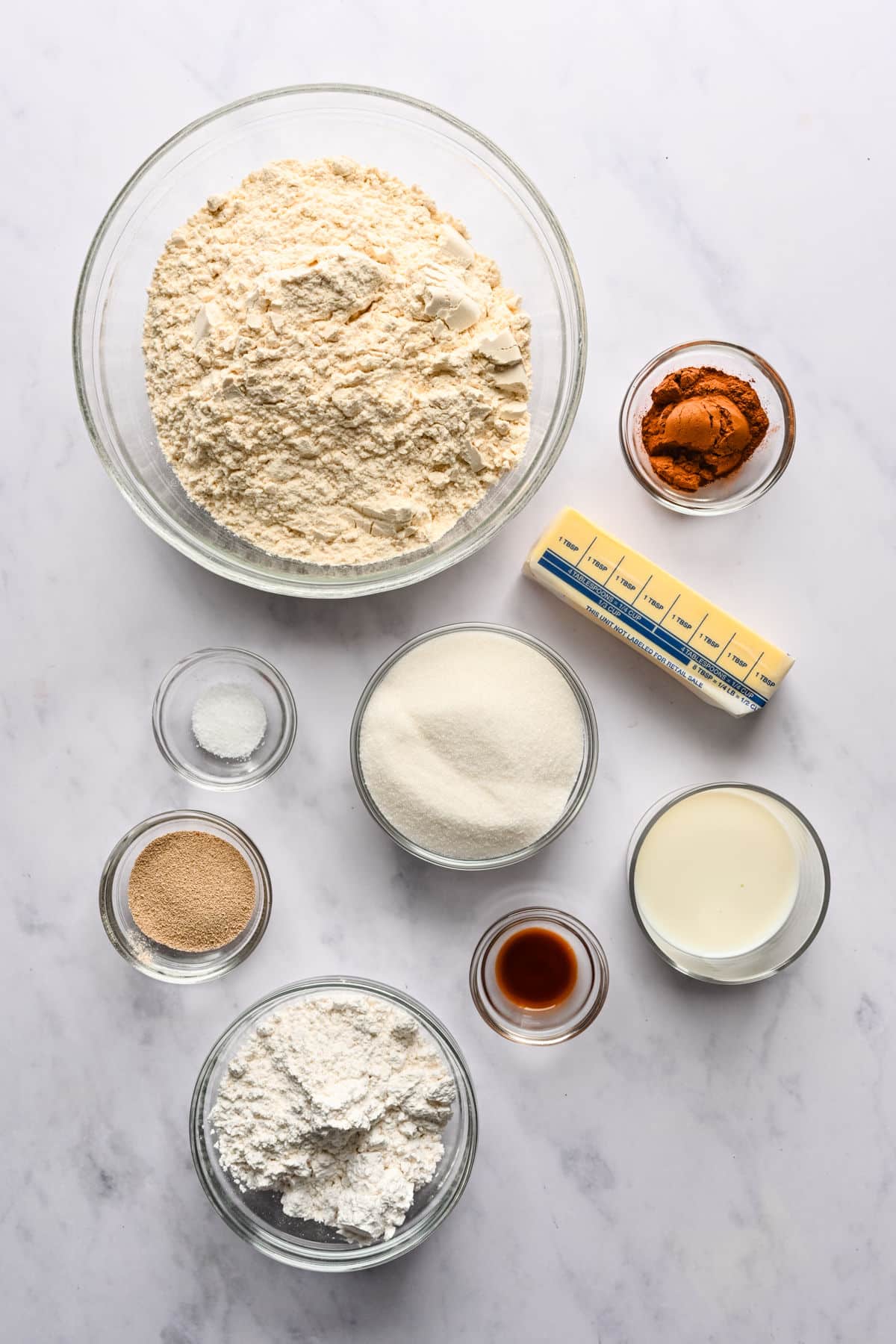 Ingredients for braided cinnamon bread in glass dishes. 