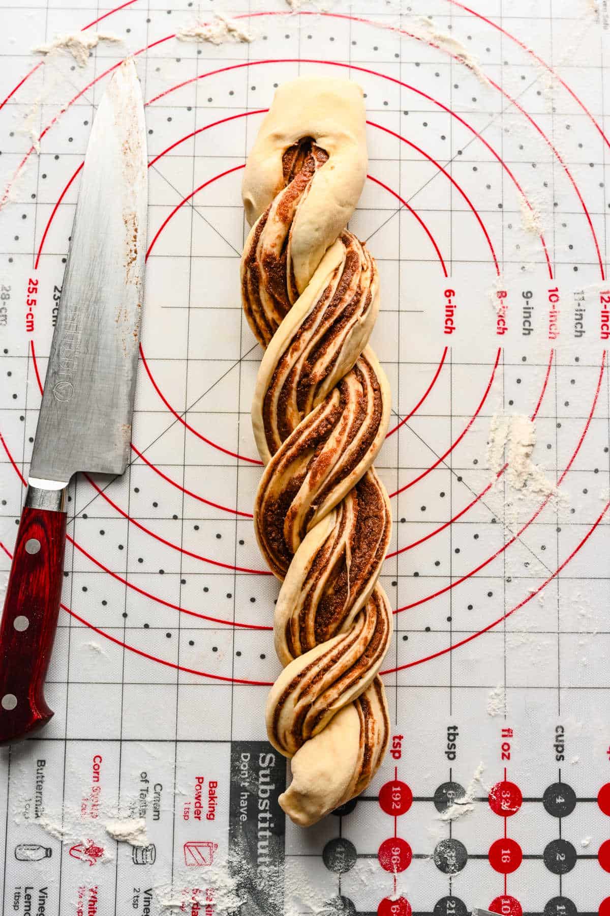 Braided cinnamon bread dough twisted over on itself. 