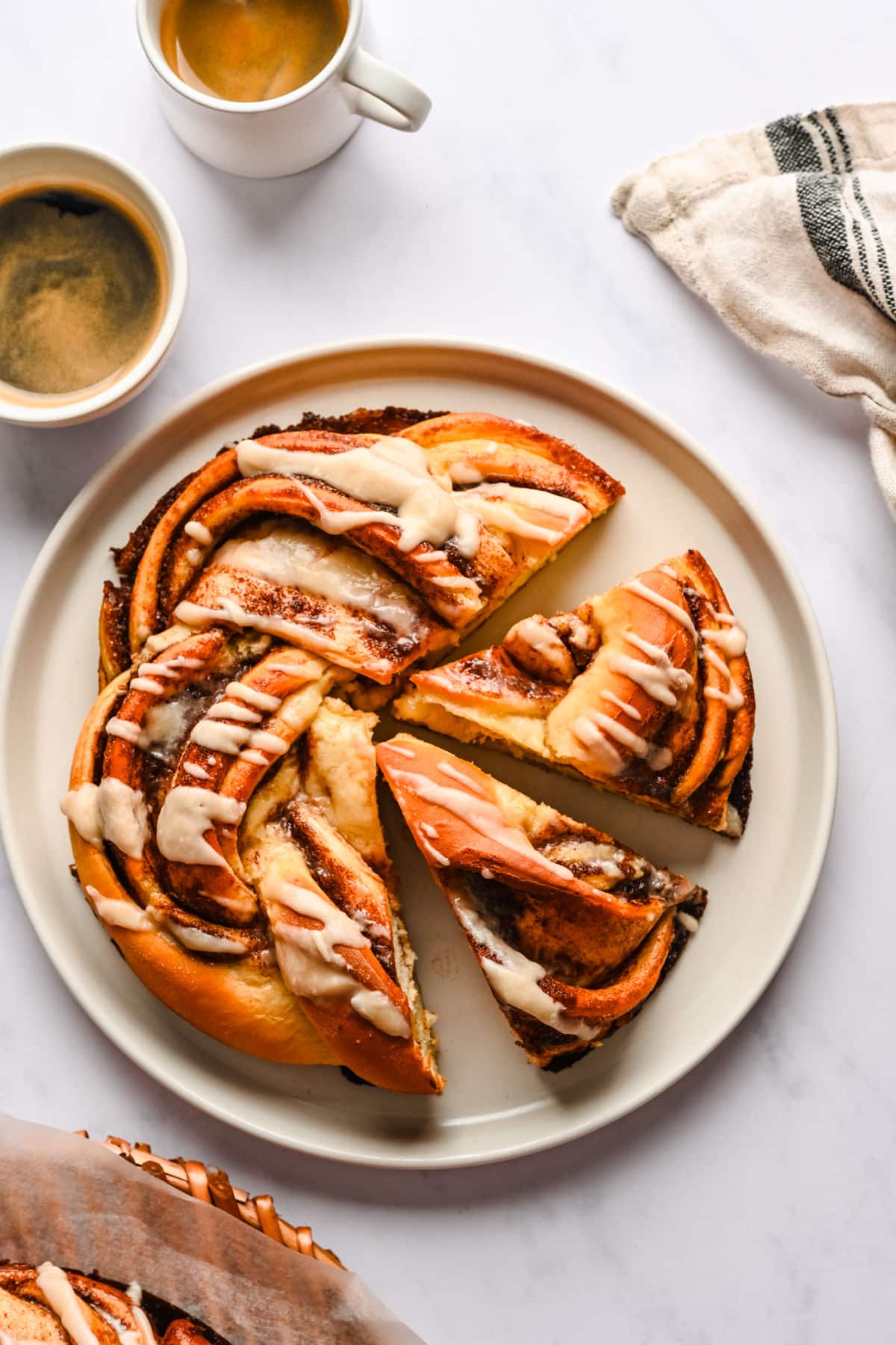 Braided Cinnamon Bread A loaf of braided cinnamon bread with two pieces cut.