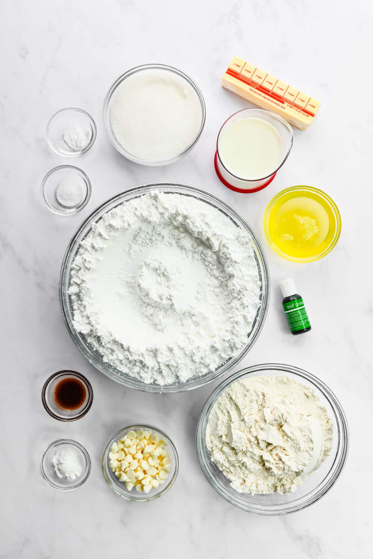 Ingredients for Christmas tree cupcakes in dishes. 