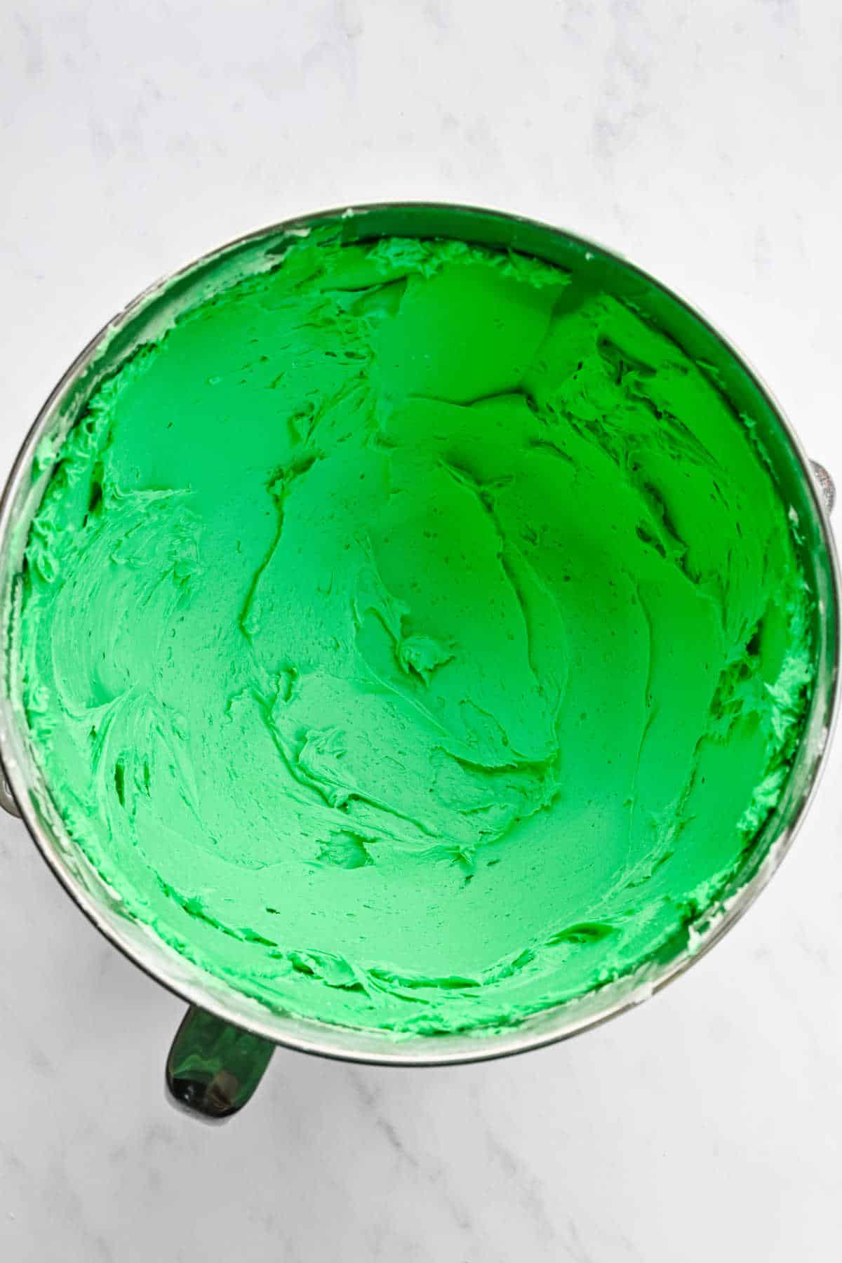 Green food coloring beaten into buttercream frosting.