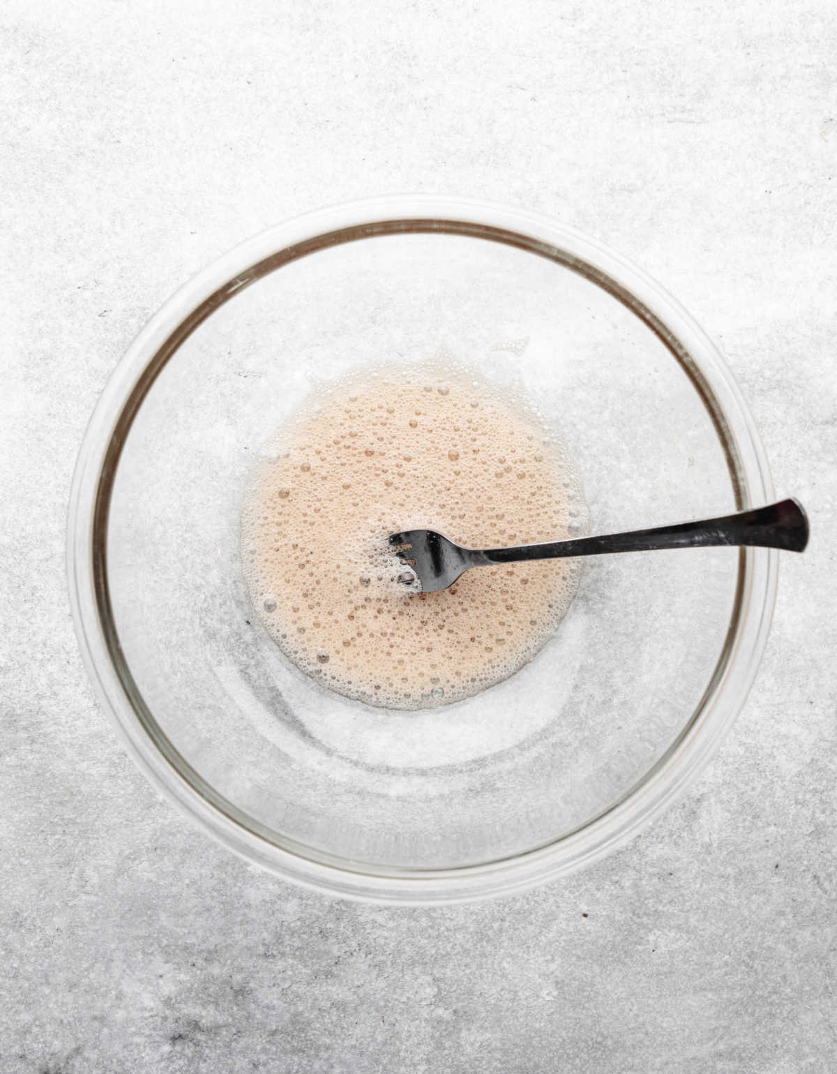 Vanilla extract stirred into frothy egg. 